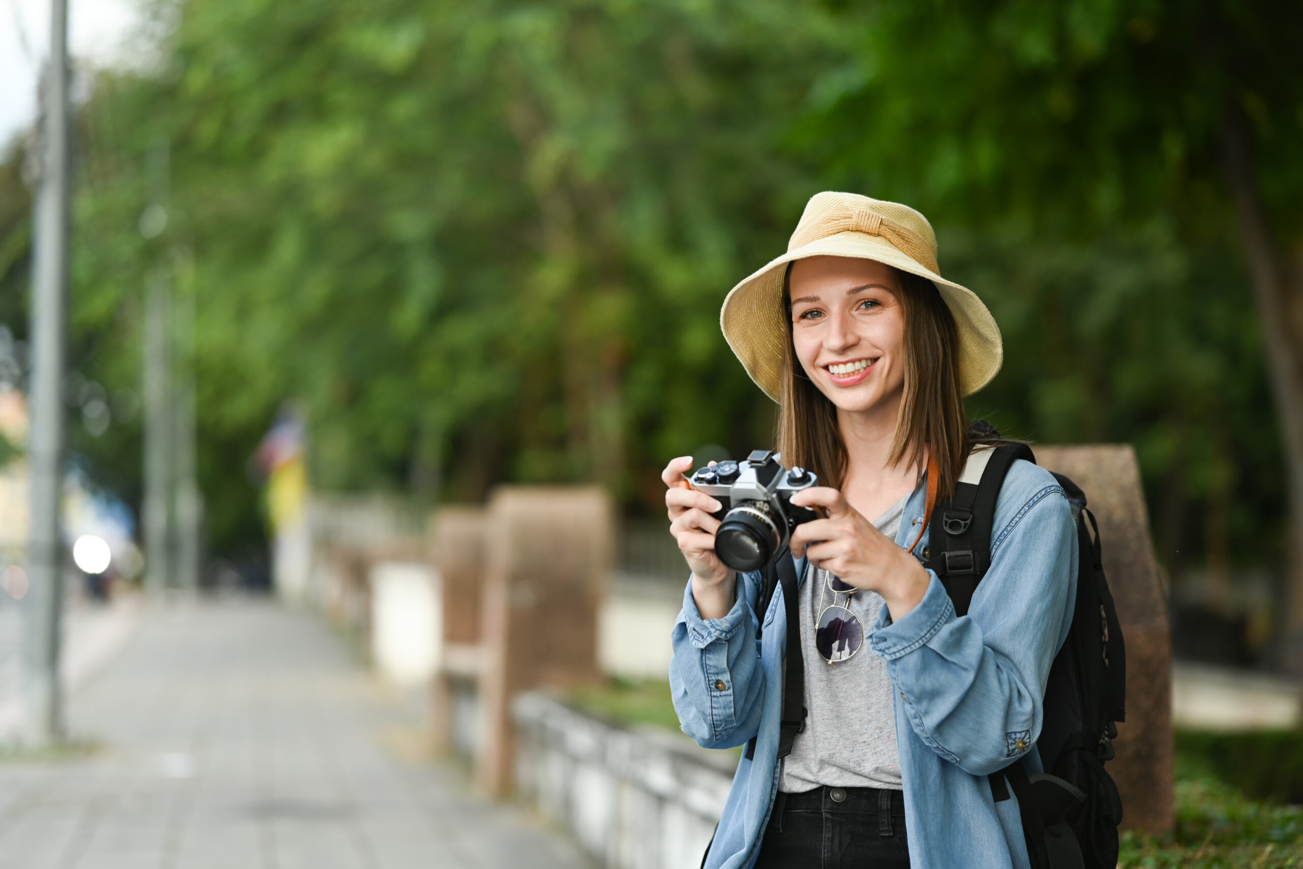 Portrait of smiling caucasian woman in hipster outfit spending f