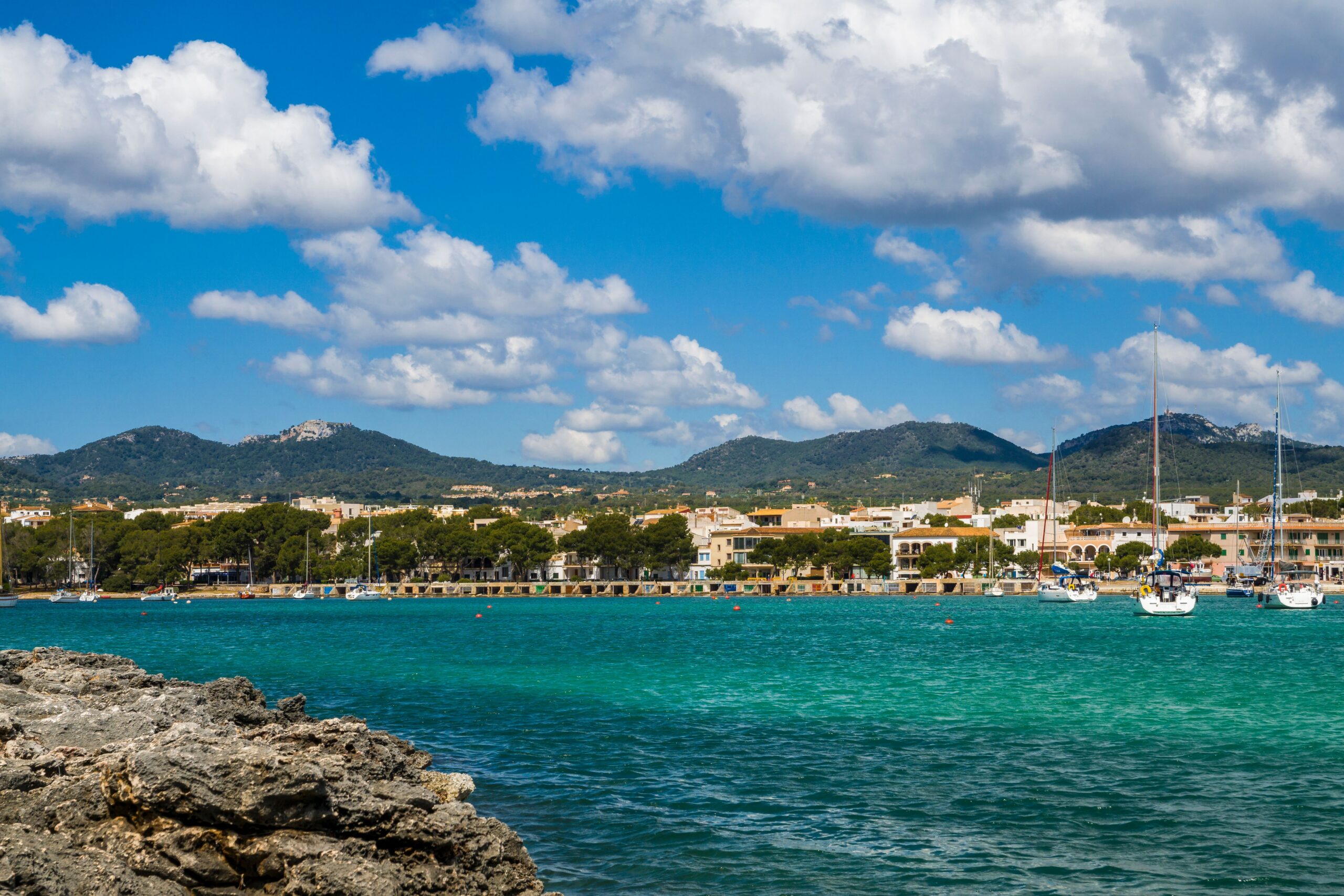 Landscape of the rocky shore surrounded by the sea on a sunny day in Mallorca, Spain
